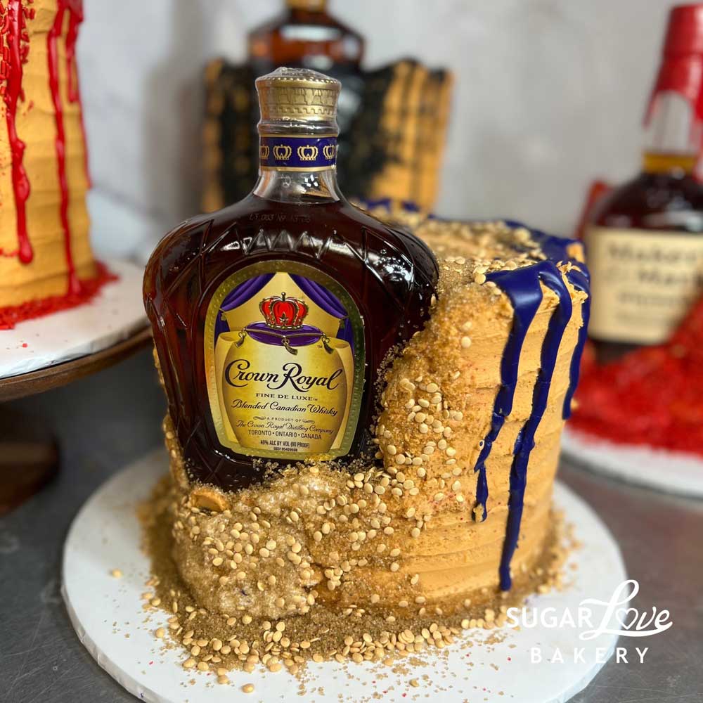 Whiskey Liquor Cake With Gold Ornaments And Drip